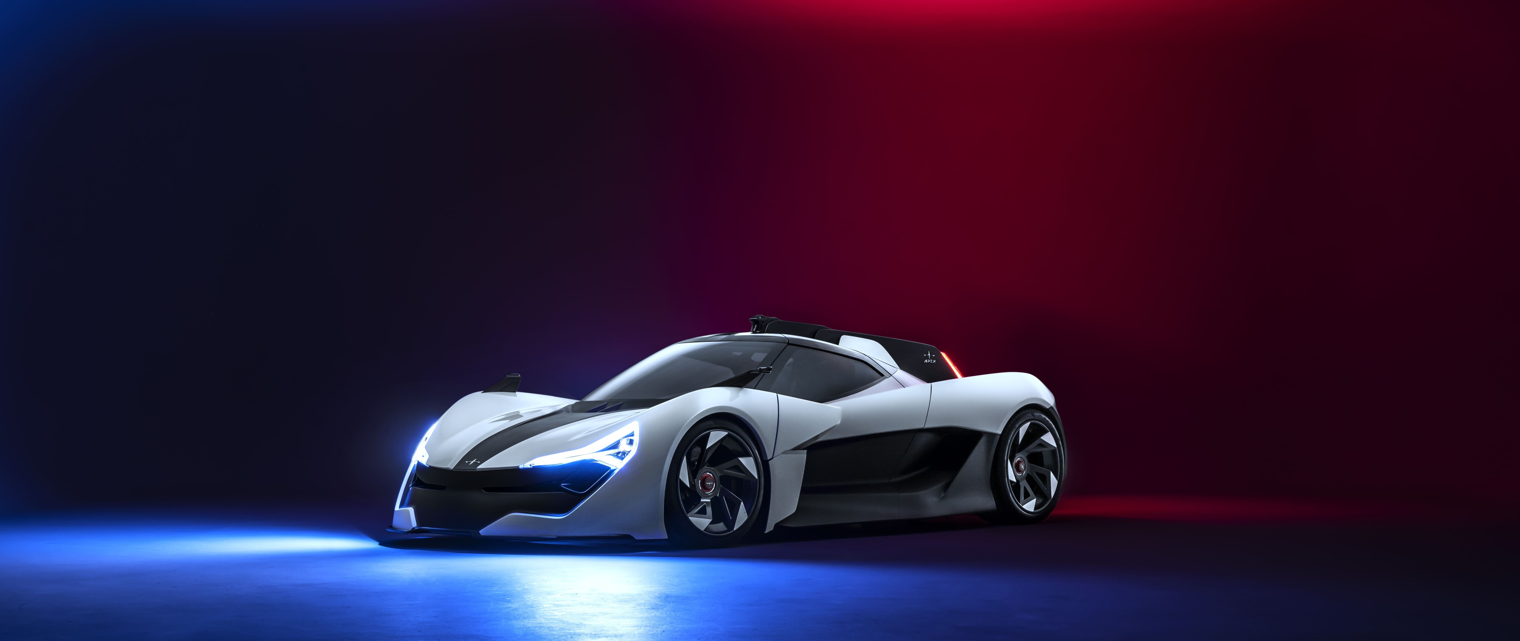 Элегантный, обтекаемый современный спортивный автомобиль, представленный в профессиональной студийной обстановке.